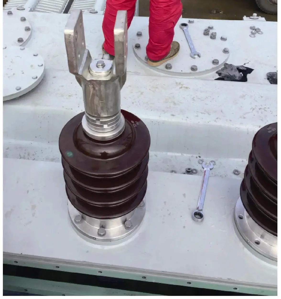 Bushing, terminal and mechanical interfaces can prevent an electrically similar pole transformer from being interchangeable.